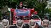 Policewomen keep watch as activists take part in a street protest on the International Day for the Elimination of Violence Against Women, in Jakarta November 25, 2024. 