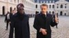 Nigerian President Bola Tinubu and French President Emmanuel Macron review an honor guard during a ceremony in Paris on Nov. 28, 2024, as part of Tinubu's state visit to France.
