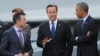英国首相卡梅伦（中），美国总统奥巴马，和北约秘书长拉斯穆森（左）出席在威尔士举行的2014年北约领导人会议。