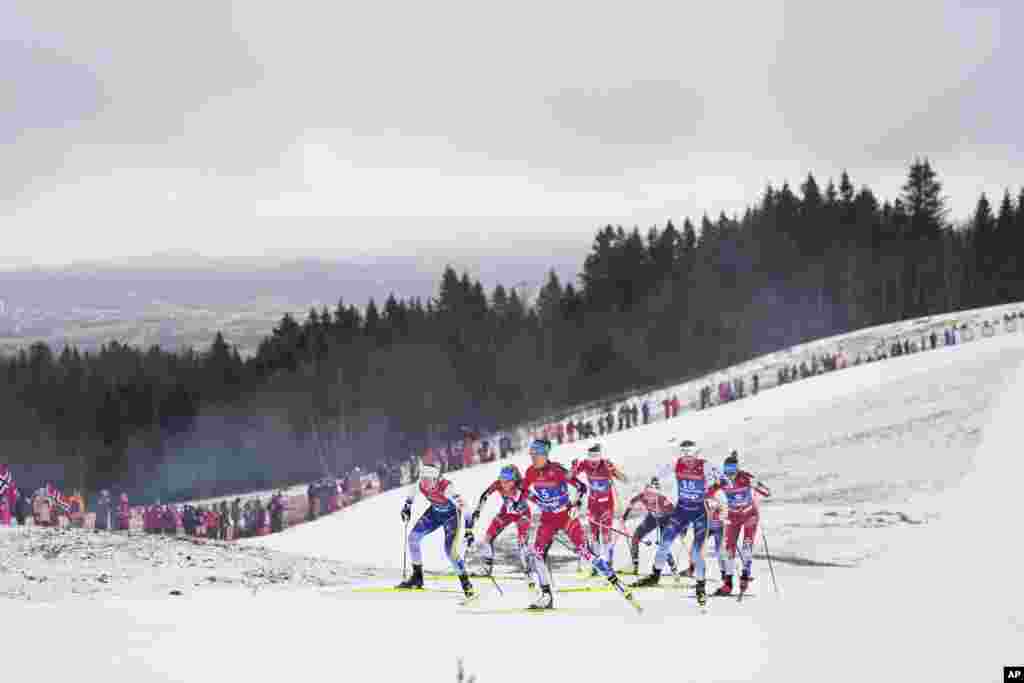 Skiers from Sweden and Austria compete in the cross-country women's mass start 50 Km at the Nordic World Ski Championships in Trondheim, Norway.