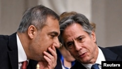 Turkish Foreign Minister Hakan Fidan speaks with U.S. Secretary of State Antony Blinken during a meeting about Syria with the foreign ministers of the Arab League in Aqaba, Jordan, on Dec. 14, 2024.