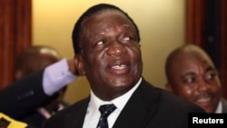 FILE: Zimbabwean Deputy President Emmerson Mnangagwa smiles at the headquarters of ZANU (PF) in Harare, Dec.10, 2014. 