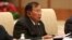 FILE - Laos' President Bounnhang Vorachith speaks with Chinese President Xi Jinping (not pictured) during a bilateral meeting at Diaoyutai State Guesthouse in Beijing, China.