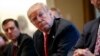 FILE - President Donald Trump listens during a meeting with steel and aluminum executives in the Cabinet Room of the White House in Washington, March 1, 2018.