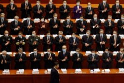 FILE - Chinese President Xi Jinping arrives for the opening session of the National People's Congress at the Great Hall of the People in Beijing, China, March 5, 2021.