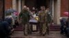 Servicemen carry the coffin of Ukrainian Captain Serhii Vatsko in Boiarka, Ukraine, on March 29, 2024. Vatsko, who was killed on the front line of eastern Ukraine on March 24, joined the military in 2014.