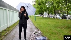 Katerina Borisevich, a journalist for the independent Tut.by news website, speaks on a mobile phone after being released from prison in the town of Gomel, some 310kms south-east of Minsk on May 19, 2021. 