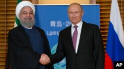 Presiden Iran dan Presiden Rusia, dua "musuh" Amerika (foto: ilustrasi). 
