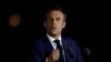 Presiden Prancis Emmanuel Macron menyampaikan pidato kemenangan setelah terpilih kembali menjadi Presiden Prancis di Champ de Mars, Paris, pada 24 April 2022. (Foto: Reuters/Christian Hartmann)