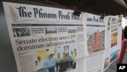 Local newspapers the Phnom Penh Post, left, and Khmer Times, right, are for sale at a newspaper's stand on a sidewalk near Monument Independence in Phnom Penh, Cambodia, Friday, Mach 1, 2024.