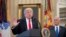 President Donald Trump, accompanied by Vice President Mike Pence, right, speaks during a signing ceremony for executive orders regarding trade in the Oval Office at the White House, March 31, 2017, in Washington. 