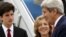 U.S. Ambassador to Japan Caroline Kennedy and her son, Jack Schlossberg, greet Secretary of State John Kerry as he arrives, ahead of G-7 foreign minister meetings, at Marine Corps Air Station Iwakuni, Japan, April 10, 2016.