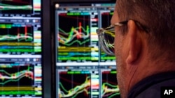 A specialist works at his post on the floor of the New York Stock Exchange on March 12, 2025.