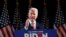 FILE - Democratic presidential candidate former Vice President Joe Biden poses for photos at a primary night election rally in Columbia, S.C., Feb. 29, 2020.