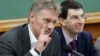 FILE - Russian President Vladimir Putin's spokesman Dmitry Peskov, left, speaks during a meeting in Moscow, Russia. 