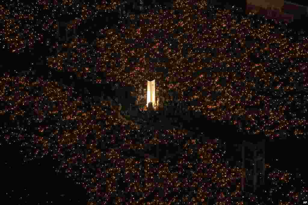 Tens of thousands of people attend a candlelight vigil at Victoria Park in Hong Kong to mark the 25th anniversary of crackdown in Tiananmen Square, June 4, 2014.