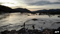 FILE - The once-mighty Mekong river has been reduced to a thin, grubby neck of water across Northern Thailand, as shown in this 2019 photo.