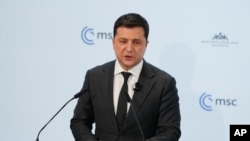 Ukrainian President Volodymyr Zelenskiy addresses participants of the Munich Security Conference in Munich, Germany, Feb. 19, 2022.