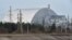 FILE - A giant protective dome built over the destroyed fourth reactor of the Chernobyl Nuclear Power Plant is seen April 13, 2021.