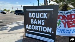 A yard sign in Phoenix encourages Arizonans on Oct. 19, 2024, to vote 'no' on retaining state Supreme Court Justices Clint Bolick and Kathryn Hackett King, who joined the high court's majority in allowing enforcement of an 1864 near-total abortion ban.