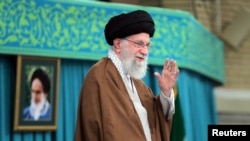 Iran's Supreme Leader Ayatollah Ali Khamenei waves during a meeting in Tehran, Iran, Oct. 27, 2024. (West Asia News Agency/Handout via Reuters)