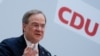 默克尔接班人主张不对中国叫板，但多方压力不许他左右逢源