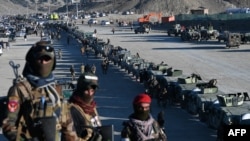 Taliban Humvees are seen parked during the funeral ceremony of Khalil Ur-Rahman Haqqani, the minister for refugees and repatriation, in Sarana, Afghanistan, on Dec. 12, 2024.