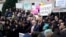 Senate Minority Leader Chuck Schumer speaks as U.S. Representative Maxine Waters stands next to him, while demonstrators rally outside the U.S. Treasury Department in Washington on Feb. 4, 2025. 
