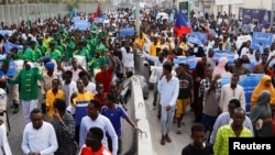 FILE - Somalis march against the Ethiopia-Somaliland port deal along KM4 street in Mogadishu, Jan. 11, 2024.