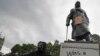 FILE - Protesters gather around the Winston Churchill statue in Parliament Square during a Black Lives Matter rally in London June 7, 2020.