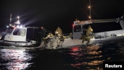 Sailors recover a suspected Chinese high-altitude surveillance balloon that was downed by the United States over the weekend over US territorial waters off the coast of Myrtle Beach, South Carolina, Feb. 5, 2023. US Fleet Forces/U.S. Navy photo/Handout via REUTERS