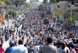 Demonstrators take part in a protest against Haiti's President Jovenel Moise, in Port-au-Prince, Haiti on Feb. 14, 2021.