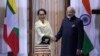 FILE - Myanmar State Counsellor Aung San Suu Kyi, left, and Indian Prime Minister Narendra Modi pose for the media ahead of their meeting in New Delhi, India, Jan. 24, 2018. 