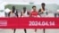 Chinese runner He Jie, second from right, Ethiopian Dejene Hailu Bikila and Kenyans Robert Keter and Willy Mnangat take part in a half-marathon in Beijing, China, April 14, 2024. (cnsphoto via REUTERS) 