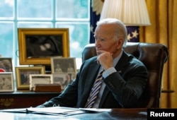 U.S. President Joe Biden attends a briefing on the federal response to the wildfires across Los Angeles, in the Oval Office at the White House in Washington, Jan. 10, 2025.