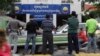 FILE PHOTO - Journalists wait in front of Cambodia National Rescue Party (CNRP) headquarters during the party's meeting, in Phnom Penh, Cambodia, Thursday, May 26, 2016. (AP Photo/Heng Sinith)