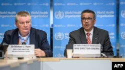 Direktur Jenderal Organisasi Kesehatan Dunia (WHO) Tedros Adhanom Ghebreyesus dan Program Gawat Darurat Kesehatan Michael Ryan dalam konferensi pers di markas WHO di Jenewa, 11 Maret 2020. 