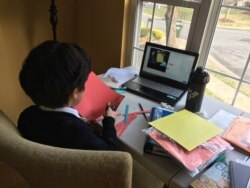 The children are taking everything from art to music to physical education online. (Eunjung Cho/VOA)