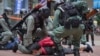 FILE - Riot police detain a protester during a demonstration against Beijing's national security legislation in Causeway Bay in Hong Kong on May 24, 2020. Hong Kong began work on a local National Security Law on Jan. 30, 2024.