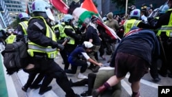 Demonstrators clash with police near the Israeli Consulate during the Democratic National Convention Aug. 20, 2024, in Chicago. 