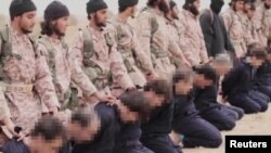 Mayakan ISIL Suna yiwa mutane kisan gilla.