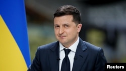 Ukraine's President Volodymyr Zelenskiy looks on during his annual news conference at the Antonov aircraft plant in Kyiv, Ukraine on May 20, 2021.
