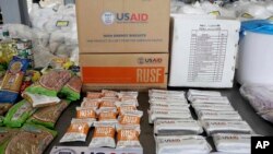 ARHIVA: Humanitarna pomoć koju distribuira USAID u skladišu u Kolumbiji (Foto: AP/Fernando Vergara)