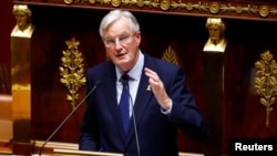 FILE - French Prime Minister Michel Barnier speaks at the National Assembly in Paris, France, Oct. 8, 2024. The government of France faces a no-confidence vote Wednesday, a move that could topple the government of Barnier. 