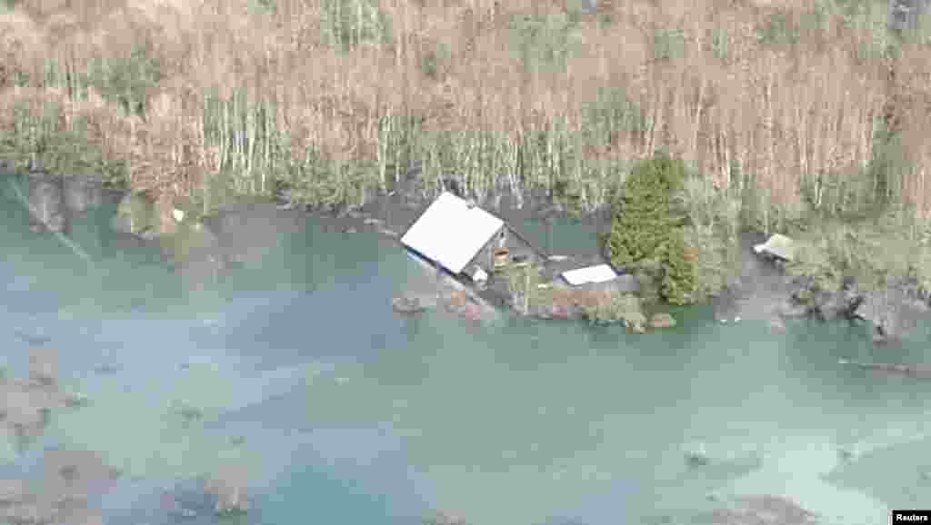 An aerial view of the area affected by a landslide near State Route 530 is seen in this photo provided by Governor Jay Inslee's office, taken near Oso, Washington March 23, 2014.