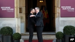 Britain&#39;s Prime Minister Keir Starmer, right, welcomes Ukrainian President Volodymyr Zelenskyy to the European leaders&#39; summit to discuss Ukraine, at Lancaster House, London.