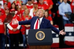 President Donald Trump addresses a campaign rally, Oct. 10, 2019, in Minneapolis.