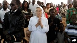 Christian worshipers pray during Christmas mass at a Church in Khartoum, Sudan, Dec. 25, 2013. 