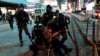 Polisi anti huru-hara menangkap demonstan di Mong Kok, Hong Kong, 10 Mei 2020. 
