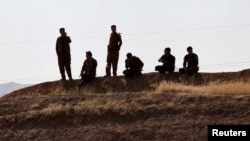 FILE - Kurdish peshmerga forces are seen near Altun Kupri, between Kirkuk and Erbil, Iraq, Oct. 20, 2017. An Islamic State attack May 1, 2021, in Altun Kupri left three Kurdish military officers dead. 